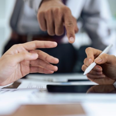 Woman hand holds stylus and puts an electronic signature in contract on tablet.